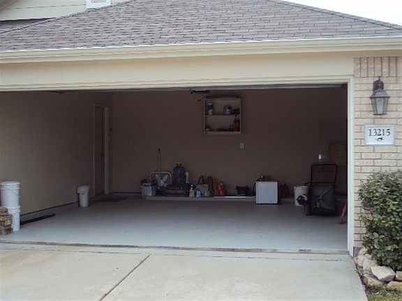 FULL SIZE GARAGE WITH REMOTE, THE GARAGE FLOOR HAS BEEN PAINTED WITH EPOXY PAINT. ACCESS YOUR HOME T