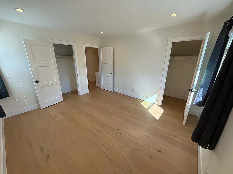Large bedroom with two closets
