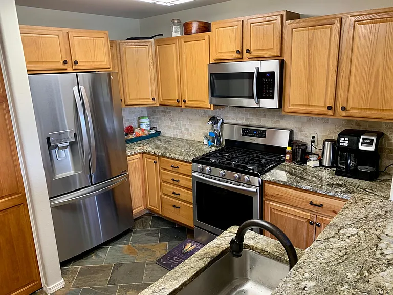 Kitchen with new stainless steel appliances and granite countertops