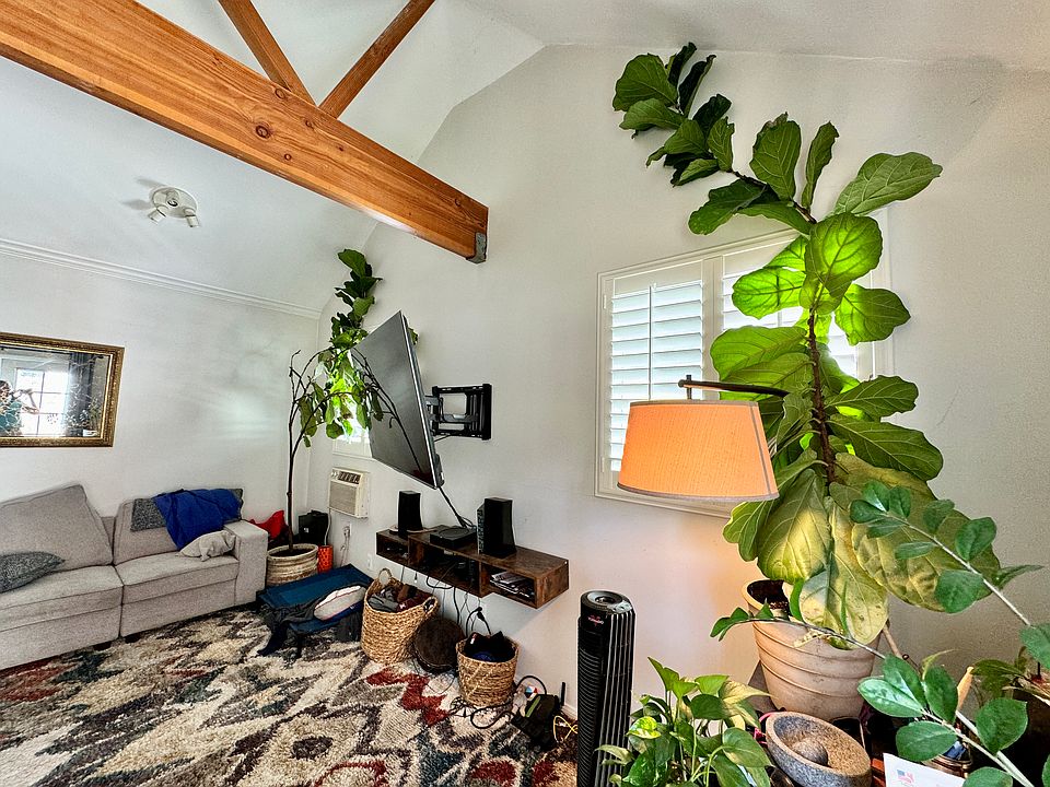 Living room with vaulted ceiling.
