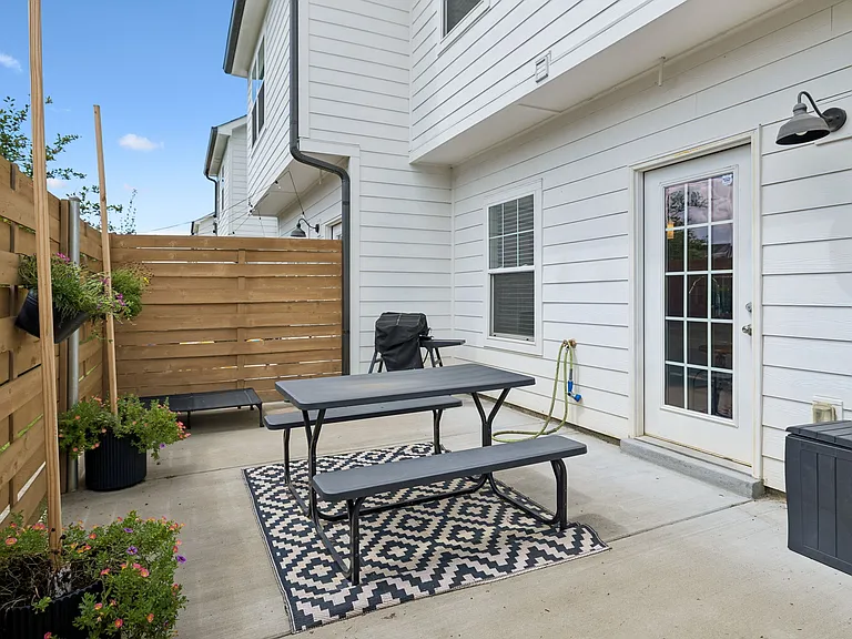 Fully fenced backyard offering low-maintenance outdoor living and privacy.