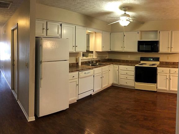 Hallway/Kitchen Newly installed stove and dishwasher in 2020.