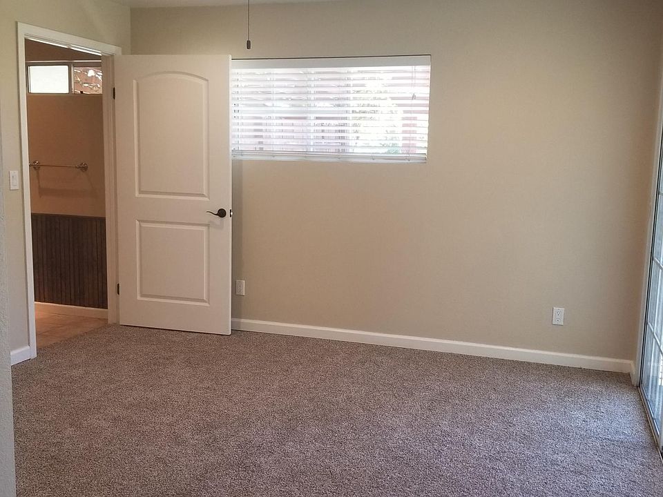 Bedroom with attached bath and slider to back yard