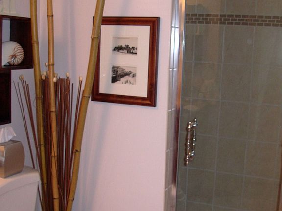 Bath with built out tiled shower