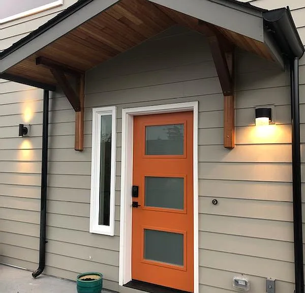 Elegantly detailed, well lit front door entry with digital access.
