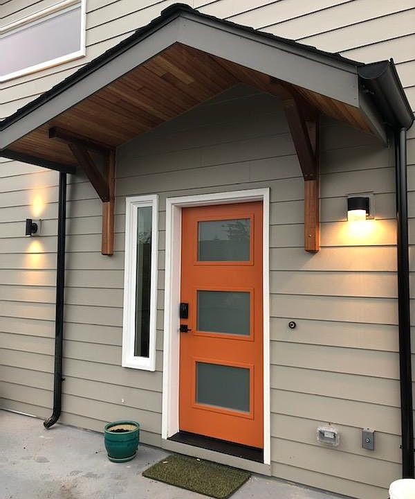Elegantly detailed, well lit front door entry with digital access.