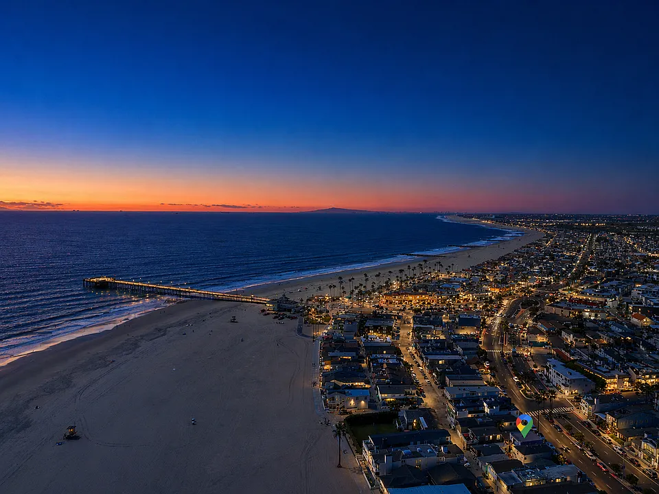 Aerial sunset views of the beach and Balboa Peninsula