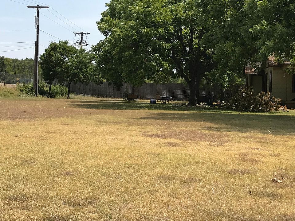 Extra large front yard with 10 pecan trees and back half of 