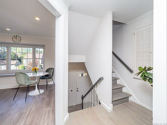 View of Entrance + Kitchen + Stairs