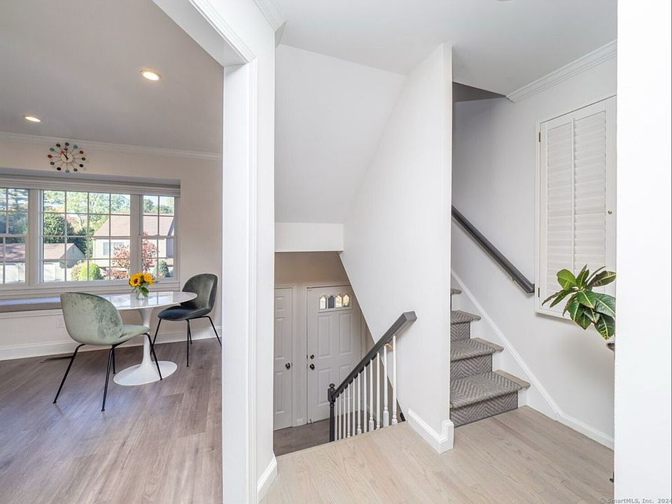 View of Entrance + Kitchen + Stairs