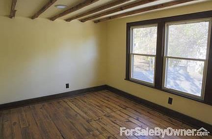 An upstairs bedroom
						:
						Completely remodeled with non-toxic paints and exposed beams.