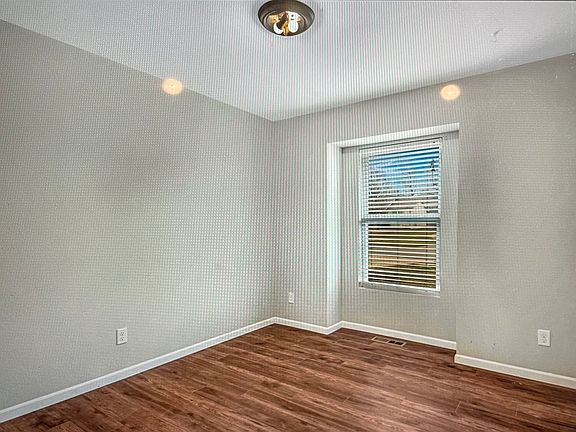 Bedroom 1 and 2 on first floor with recessed windows, aiding in reduced wind noise and accumulation of dirt.