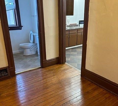 Office looking into half bath and kitchen