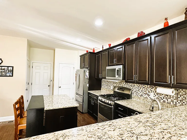 Kitchen (with doors leading to garage and basement)