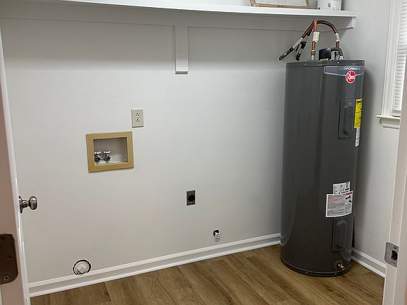 Laundry room with new water heater