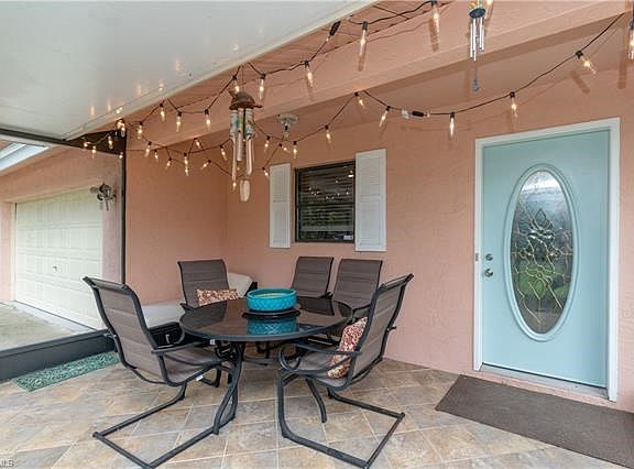 Screened Lanai with tile flooring.