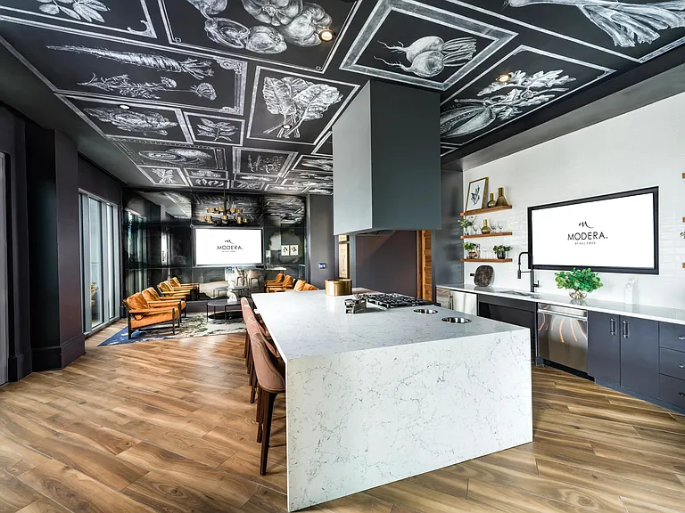 Enter the demonstration kitchen at Modera Old Ivy, where statement finishes, open seating, and curated design create a social hub in Atlanta.