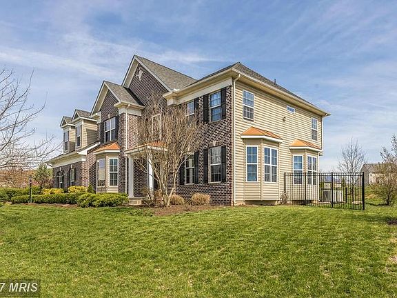 Brick Front and 3 Bay Windows