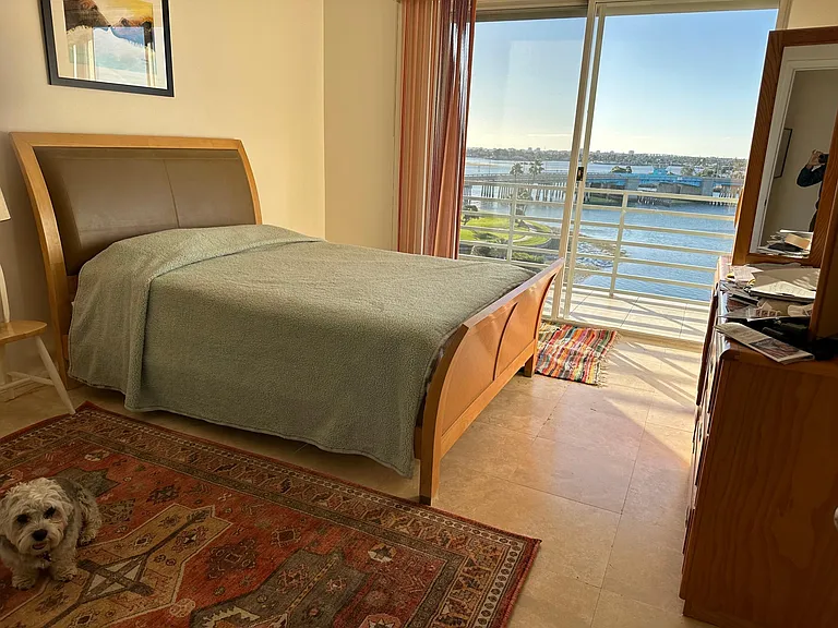 bedroom has ocean view as well as living room