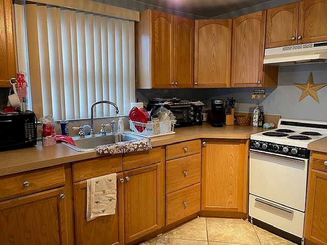 Spacious Full Size Kitchen, w/ Microwave, Full Size Refrigerator, Plenty of Countertops and Cabinets.