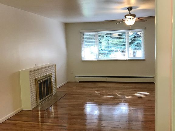 Dining looking toward living room with fireplace