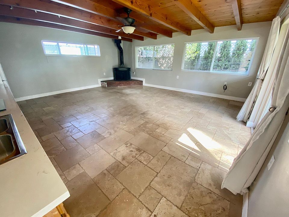 Main studio space with kitchen area and fireplace