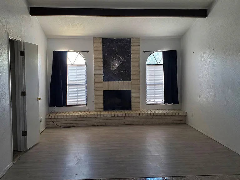 Living/dining/kitchen area is open floor plan with vinyl and tile flooring throughout the house.