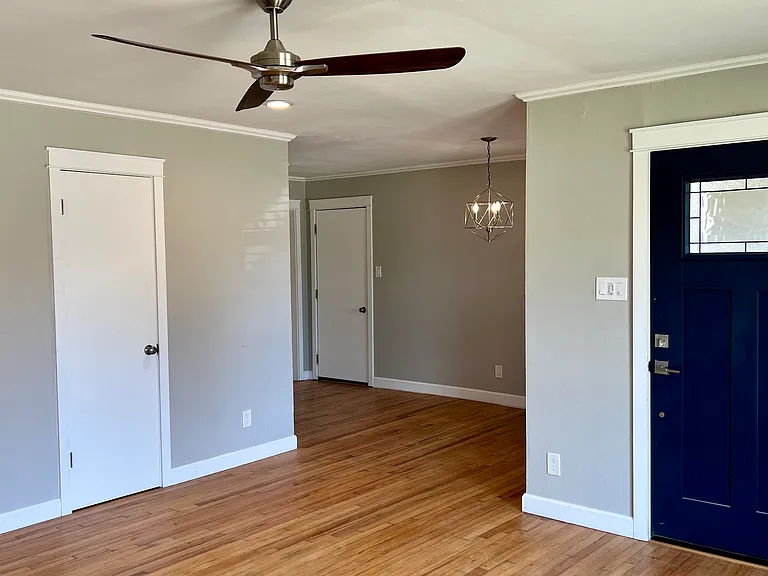 Living room looking towards entry door and dining room