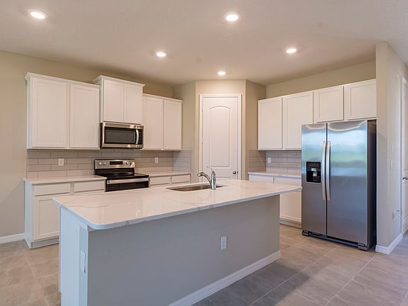 Stainless steel appliances come included with the Sorrento by LGI Homes