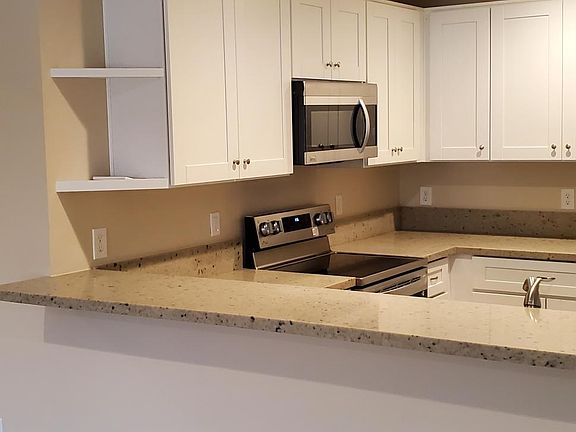 Kitchen has this bar and overlooks the dining room.