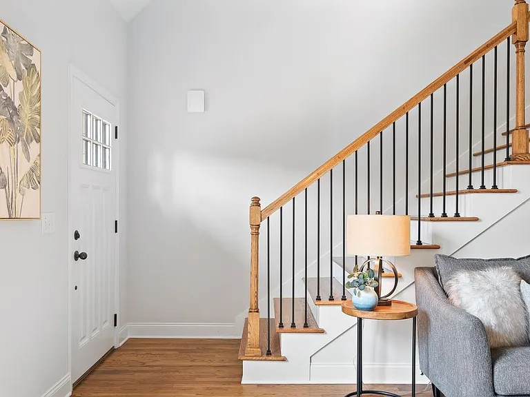 Front entry with oak hardwood floors and stairs leading to 2nd level, newly refinished.