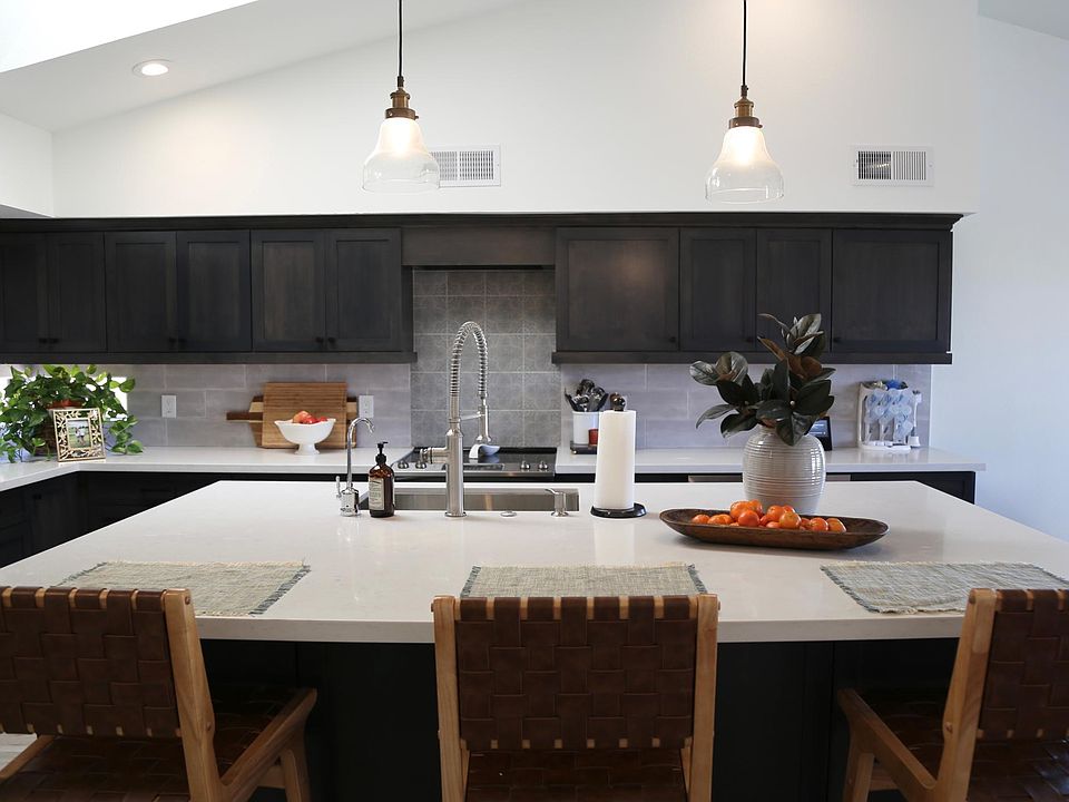 Open concept kitchen and dining room - vaulted ceilings, soft close cabinets, huge 8ft x 5ft island with 4 storage cabinets underneath.