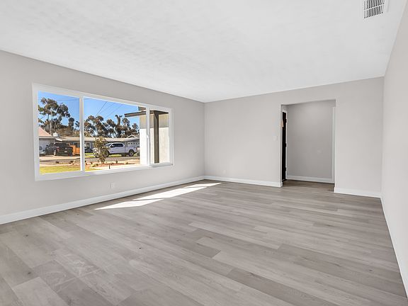 Front Living Room with a view towards Entryway/Front Door Area
