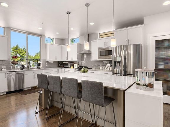 Gorgeous kitchen with stainless steel appliances and quartz countertops