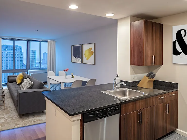 Classic Package I with gourmet kitchens including granite counter tops, stainless steel Whirlpool appliances, gas stovetop, and hard surface flooring