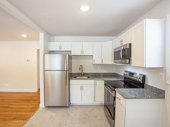 Kitchen with new stainless steel appliances and granite counter tops