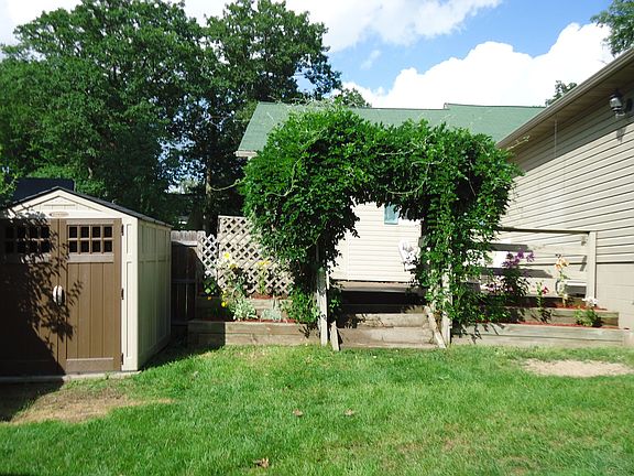 back view looking towards the patio and the brand new storage shed
