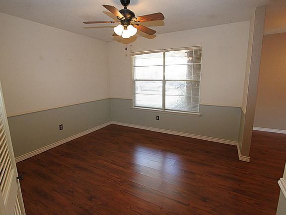 Dining area with laminate wood floors.