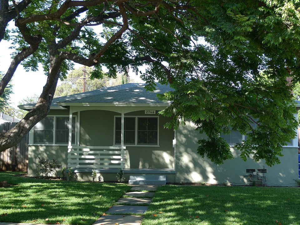 Front porch shaded by the Chinese silk tree