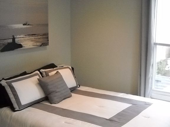 Queen-sized bed and light-filled rooms!