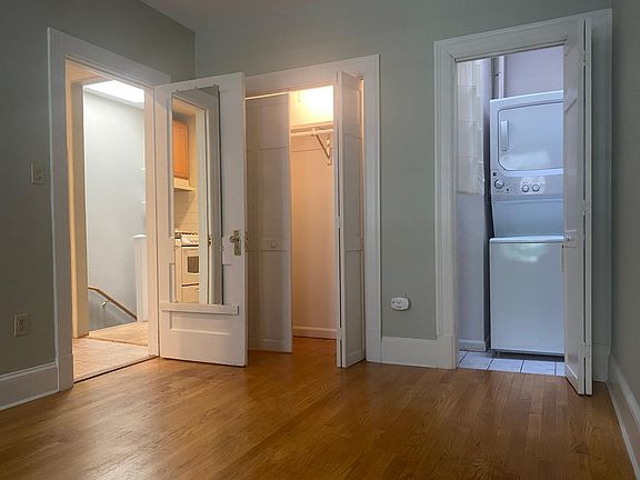 Bedroom showing closet & W/D