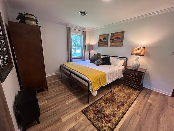 PRIMARY BEDROOM WITH KING SIZED BED