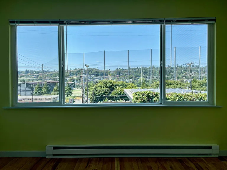 View from big windows in living room. Golf center, Magnolia, and beyond.