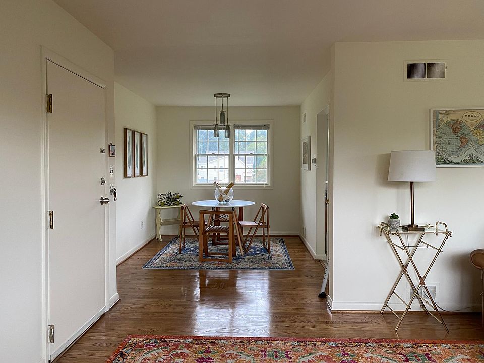 View of Dinette from Living Room with Current Tenant's Furniture