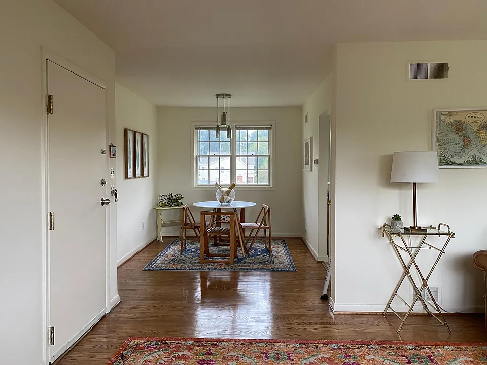 View of Dinette from Living Room with Current Tenant's Furniture