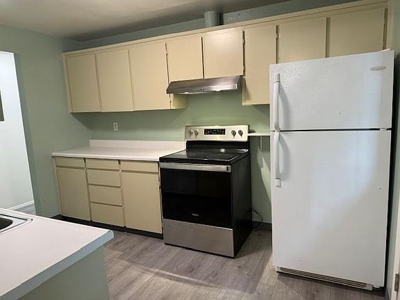 Laminate wood floors and newly painted walls ceilings and cabinets.