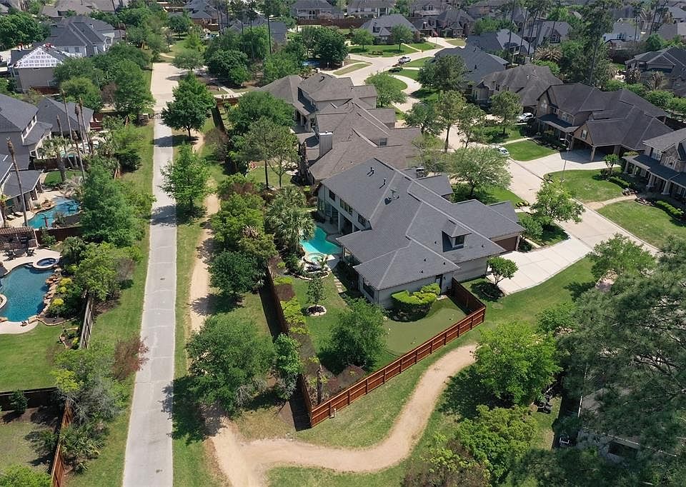 Aerial view from the back, no rear neighbors, Pool, Putting Green, and Professional landscaping!
