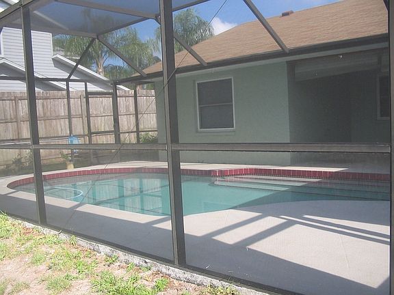 Pool and newly screened  lanai perfect for lounging or having cookouts.
