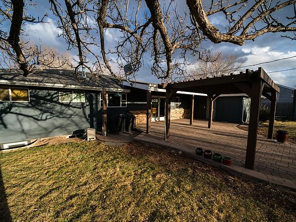 Backyard with pergola and patio. Great for entertaining and relaxing