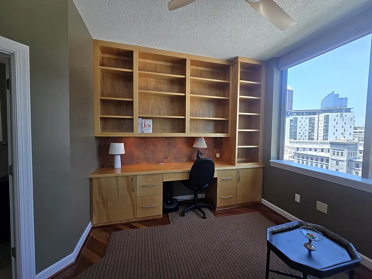 Wooden desk, file cabinets and shelving! Dream Office overlooking the downtown skyline.